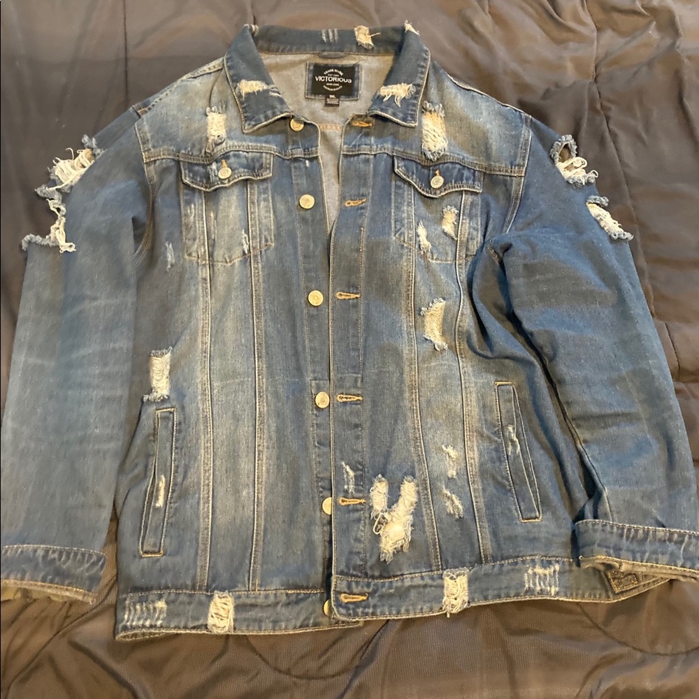 This is a ripped Jean jacket modern style